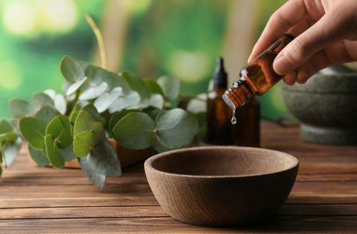 Woman pouring essential oils